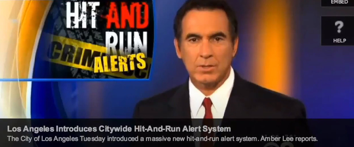 Television news anchor reporting about new hit-and-run alert system