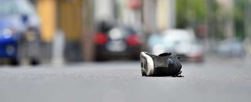 Lone shoe in the roadway after a pedestrian struck by car